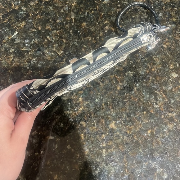 Coach Wristlet approximately 7.5 inches long by 5 inches wide. Good condition. - Picture 5 of 6